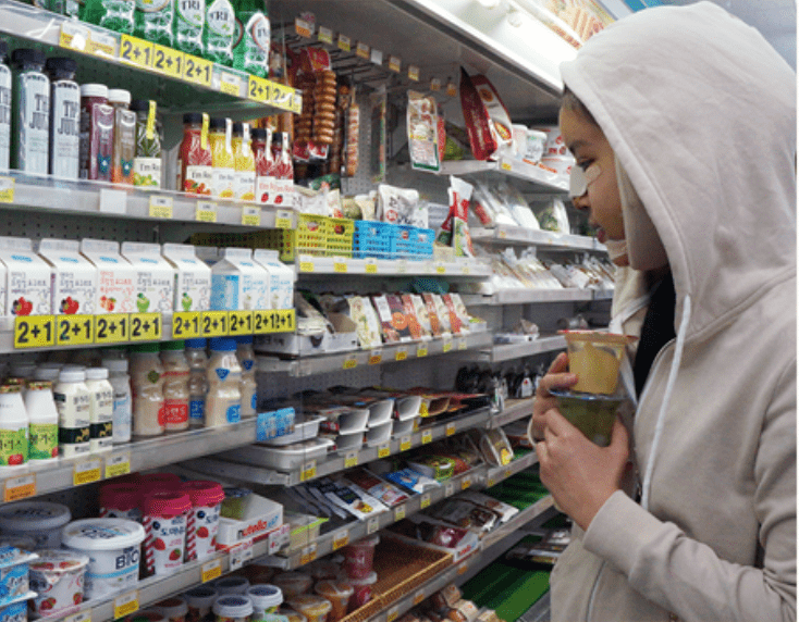 Image of the model shopping at a convenience store